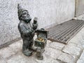 The small bronze statue gnome by name - Lombardzik, gnome with chest full of coins