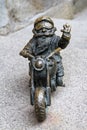 The small bronze statue gnome by name - Wentyl, gnome-biker on motorcycle