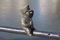 Small bronze statue of Good Soldier Svejk attached to the handrails at Kyivska embankment of the river Uzh in Uzhgorod Ukraine pho