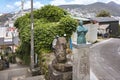 Small bronze statue of the Japanese samurai Sakamoto Ry?ma in kimono in a backstreet of Kazagashira park.