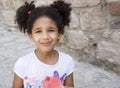 Small brown girl African American appearance eating watermelon Royalty Free Stock Photo