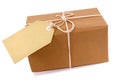Small brown paper parcel package, blank label, copy space