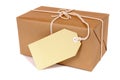 Small brown parcel package, blank label, isolated white background Royalty Free Stock Photo