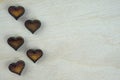 Small brown wooden hearts top view. Royalty Free Stock Photo