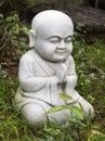 Small Buddha statue in a garden