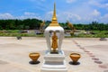 Small Buddha stupa and circular cloth mats on the floor at the entrance of Buddhist temple Ban Nong Chaeng, Phetchabun, Thailand