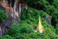 Small buddhist golden pagoda in the forest at Pindaya caves, Myanmar