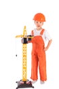 Small builder and crane on white background Royalty Free Stock Photo