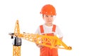 Small builder and crane on white background Royalty Free Stock Photo
