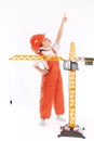 Small builder and crane on white background Royalty Free Stock Photo