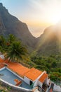 Small buildings with orange roof tiles with a view on a sunset over Masca Village and valley in Tenerife, Canary Islands Royalty Free Stock Photo