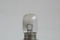 Weak yellow bulb light. small bulb black and white background Royalty Free Stock Photo