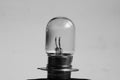 Weak yellow bulb light. small bulb black and white background Royalty Free Stock Photo