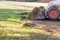 Small Bulldozer Removing Grass From Yard Preparing For Pool Installation Royalty Free Stock Photo