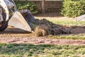 Small Bulldozer Removing Grass From Yard Preparing For Pool Installation Royalty Free Stock Photo