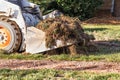 Small Bulldozer Removing Grass From Yard Preparing For Pool Installation Royalty Free Stock Photo