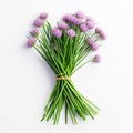 small bunch of fresh purple chives on a white table