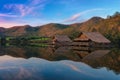 Small bungalow made of bamboo floating at lake