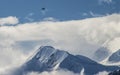 A small bush plane flies over Mt. Denali.