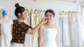 Small Business of Asian women Fashion Designer Working With Wedding Dresses at  clothing store Royalty Free Stock Photo