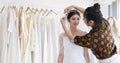 Small Business of Asian women Fashion Designer Working With Wedding Dresses at  clothing store Royalty Free Stock Photo