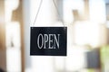 Small business, cafe and advertising with open sign for marketing, board or start of opening hours. Welcome, entrance Royalty Free Stock Photo