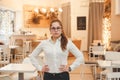 Small business, cafe female owner standing in empty cafe, waiting for clients Royalty Free Stock Photo