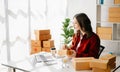 Small business entrepreneur SME freelance woman working at office, BOX,tablet and laptop online, marketing, packaging, delivery, Royalty Free Stock Photo