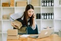 Small business SME freelance woman working at home office, BOX,tablet and laptop online, marketing, packaging, delivery, concept Royalty Free Stock Photo