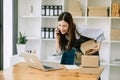 Small business SME freelance woman working at home office, BOX,tablet and laptop online, marketing, packaging, delivery, concept Royalty Free Stock Photo