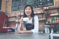 Small business: Happy owner of a cafe. Young startup owner small