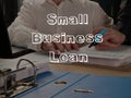 Small business loan is shown on the conceptual business photo