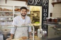 Small business owner behind the counter of a sandwich bar Royalty Free Stock Photo