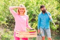 Small business owner selling organic fruits and vegetables. Image of two happy farmers with instruments. Royalty Free Stock Photo