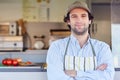 Small business owner smiling in front of his takeaway food busin Royalty Free Stock Photo