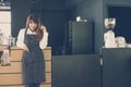Small business owner standing at counter in coffee shop. female Royalty Free Stock Photo