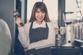 Small business owner standing at counter in coffee shop. female Royalty Free Stock Photo