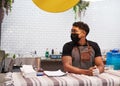 A small business owner stands at his food stall waiting for customers with mask Royalty Free Stock Photo