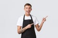 Small business owners, coffee shop and staff concept. Happy good-looking part-time worker in cafe, barista or waiter in Royalty Free Stock Photo