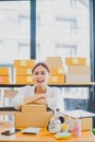 Small business owners online smiling happily at work. where customers place orders and check the orders that the customers have Royalty Free Stock Photo