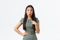 Small business owners, women entrepreneurs concept. Surprised and shocked asian woman in dress asking question and Royalty Free Stock Photo