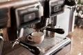 Small business, people and service concept. Bartender in apron with holder and tamper preparing coffee at coffee shop