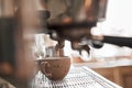 Small business, people and service concept. Bartender in apron with holder and tamper preparing coffee at coffee shop