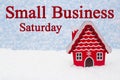 Small Business Saturday message with winter store and snow Royalty Free Stock Photo