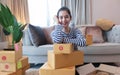 Small Business SME entrepreneur of Young Asian women working with laptop for Online shopping at home,Cheerful and Happy with box Royalty Free Stock Photo