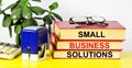 Small business solutions. Text label in on textbooks. Royalty Free Stock Photo