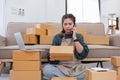 Small Business, Startup SME, Owner Entrepreneurs. Asian woman with unsuccess business online shopping crying and serious