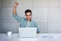 Small Business and Successful Concept. Young Asian Businessman Glad to recieve a Good News or High Profits from Computer Laptop, Royalty Free Stock Photo