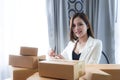 Business woman is preparing to send out her product in boxes Royalty Free Stock Photo