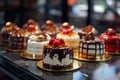 Small cakes on display at the patisserie counter. Pastry shop glass display with cakes. Generative AI